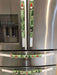 Gnomes on The Green Christmas Appliance Handle Covers on refrigerator handles in festive green and red design.