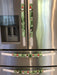 Gnomes on The Green Christmas Appliance Handle Covers on refrigerator handles in festive colors.