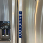 Stainless steel appliance with a decorative blue handle cover featuring white snowflakes.