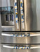 Stylish blue appliance handle covers featuring white and yellow daisies, adding modern décor and protection.