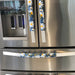 Stylish blue appliance handle covers featuring white and yellow daisies, adding modern décor and protection.
