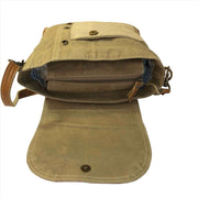 Brown leather bag with a strap on a white background