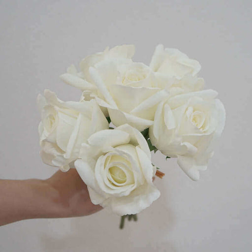Artificial latex rose bouquet - Stunning white roses in a hand for elegant floral decor.