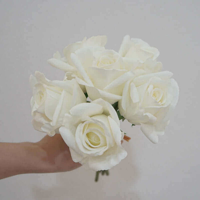 Artificial latex rose bouquet - Stunning white roses in a hand for elegant floral decor.