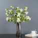 Artificial osmanthus tall stems arranged in a sleek vase, showcasing elegant floral design for home decor.