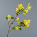 Artificial Osmanthus tall stems with yellow flowers and green leaves on a gray background.