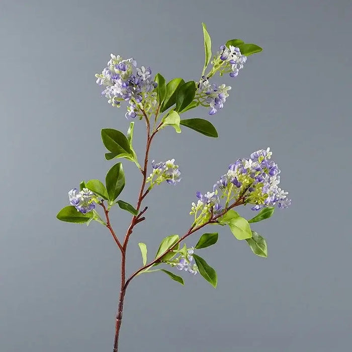artificial osmanthus tall stems with realistic purple flowers and green leaves on a grey background.