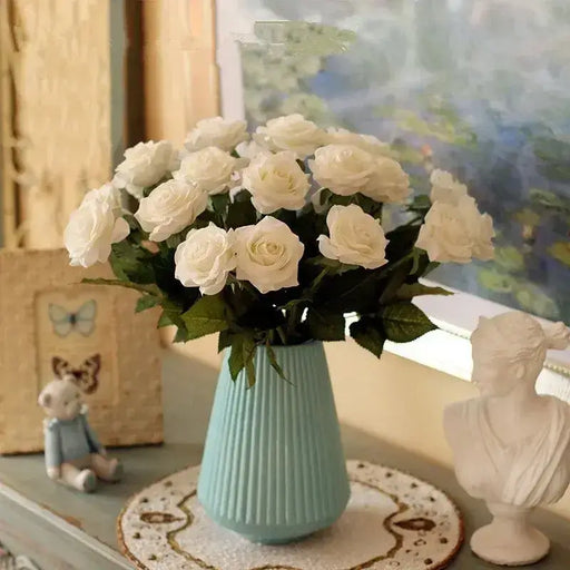 Artificial Real-Touch Rose Flower Stems in a blue vase with white roses and green leaves, enhancing room decor.