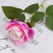 Artificial real-touch rose flower stems with pink blooms and green leaves on a decorative background.