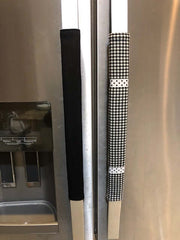 Buffalo plaid appliance handle covers on refrigerator handles in black and white colors.