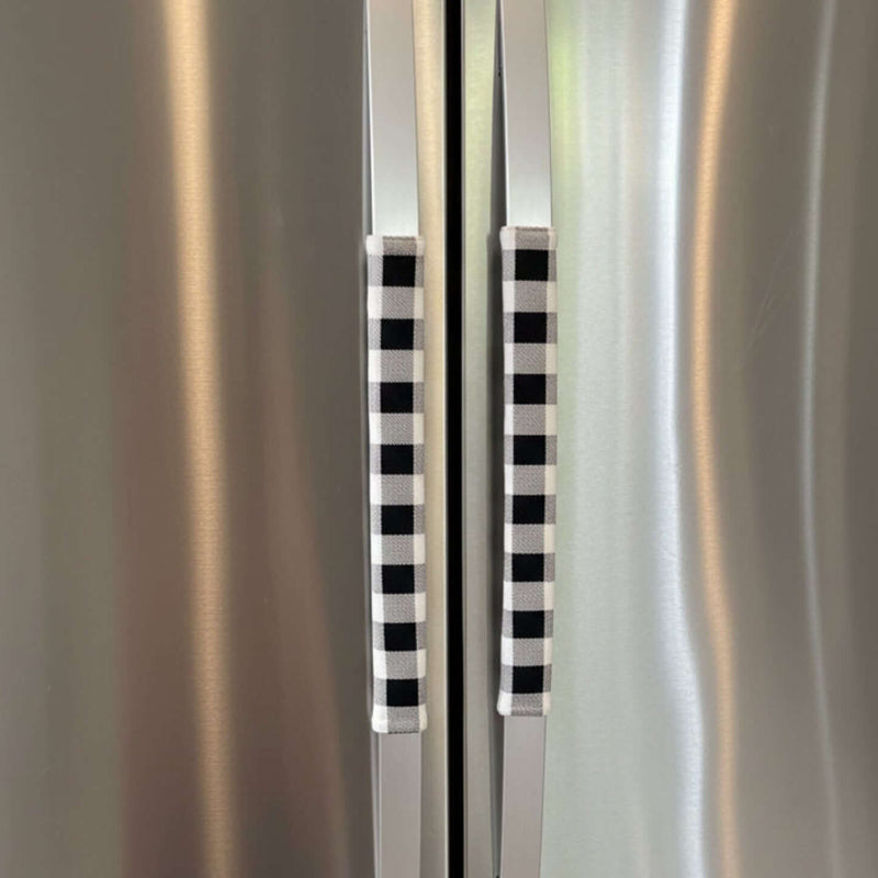 Stainless steel refrigerator with black and white checkered handles