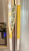 Cute puppy print on appliance handle covers adding charm to a refrigerator.