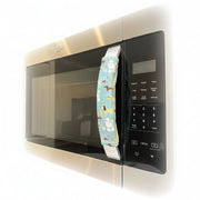 Cute puppy print on appliance handle covers displayed on a microwave, adding charm to the kitchen decor.