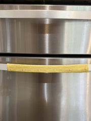 Cute puppy print on appliance handle covers for refrigerator, adding charm and functionality to the kitchen decor.