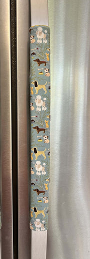Cute puppy print on appliance handle covers featuring various dog designs on a blue background.