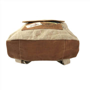 Eco-Friendly Canvas Backpack with rugged upcycled materials and leather accents.