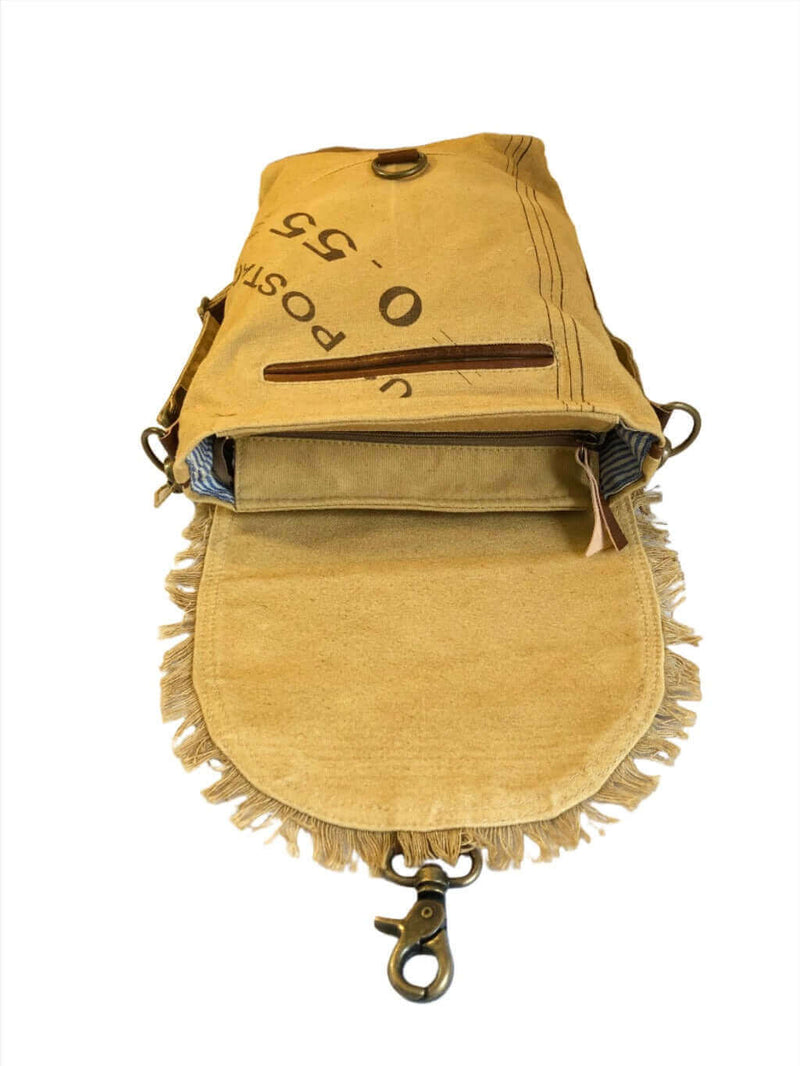 Eco-friendly canvas leather flap shoulder bag with fringe detailing and zippered pocket.