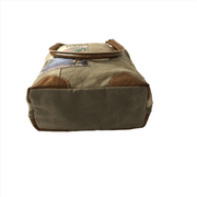 Eco-friendly Cape Breton tote bag base view showing patchwork design and leather accents.