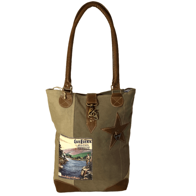 Eco-friendly Cape Breton tote bag with leather star and patchwork design, perfect for casual outings and stylish accessorizing.