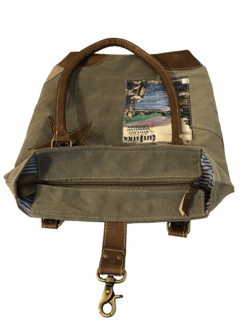 Eco-Friendly Cape Breton Tote Bag with leather star and unique patchwork design, showcasing rustic charm.
