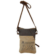 Eco-Friendly Passport Bag featuring burlap and leather design, perfect travel accessory inspired by North Dakota.