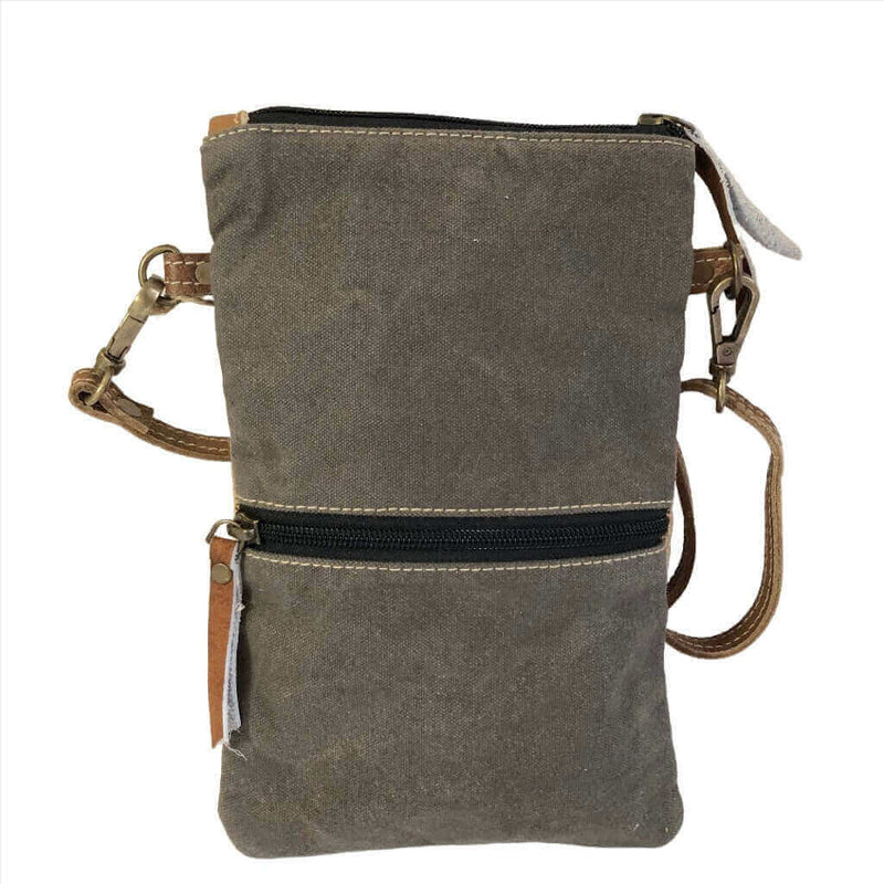 Eco-friendly passport bag made from repurposed military tent; perfect for travel.