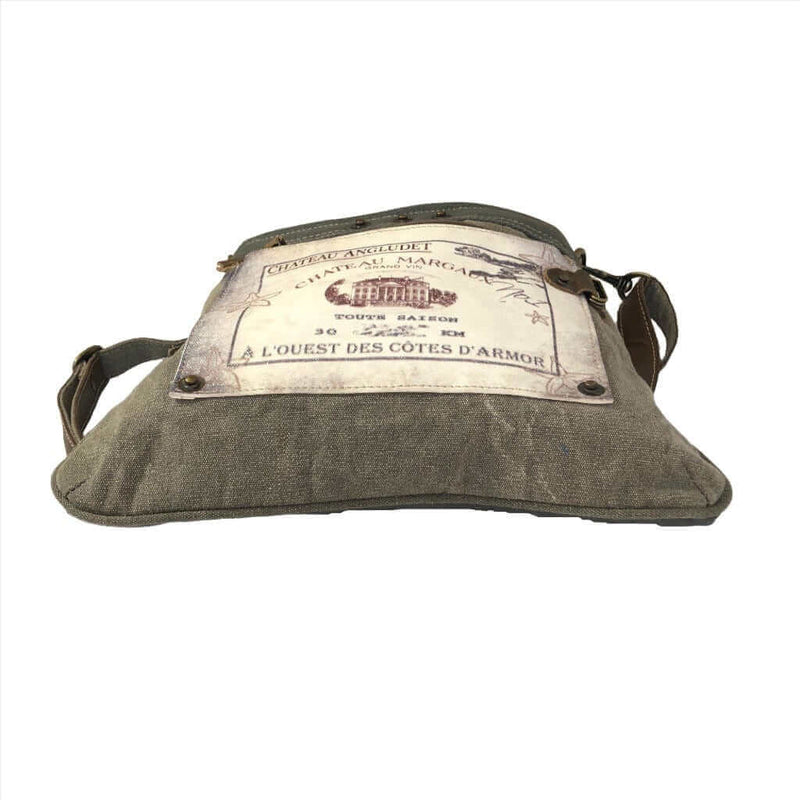 Eco-friendly shoulder bag Chateau Margaux made from upcycled canvas and leather, featuring functional pockets and adjustable straps.