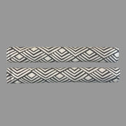 2 horizontal appliance handle covers  with geometric patterns on a white surface 