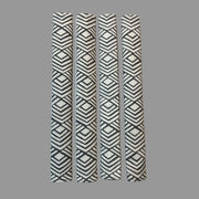 Four vertical appliance handle covers  with gray geometric patterns on a white surface 