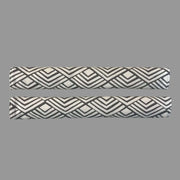 2 horizontal appliance handle covers  with geometric patterns on a white surface 