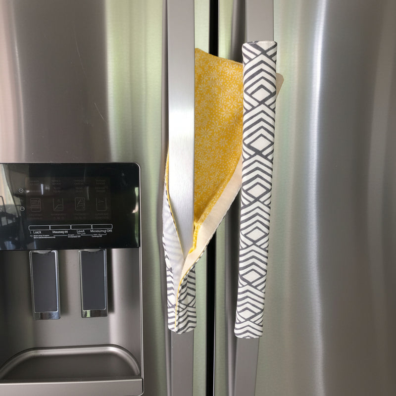 Geometric Refrigerator Handle Covers - Grey and White on stainless steel fridge, featuring a sunny yellow flip side view.