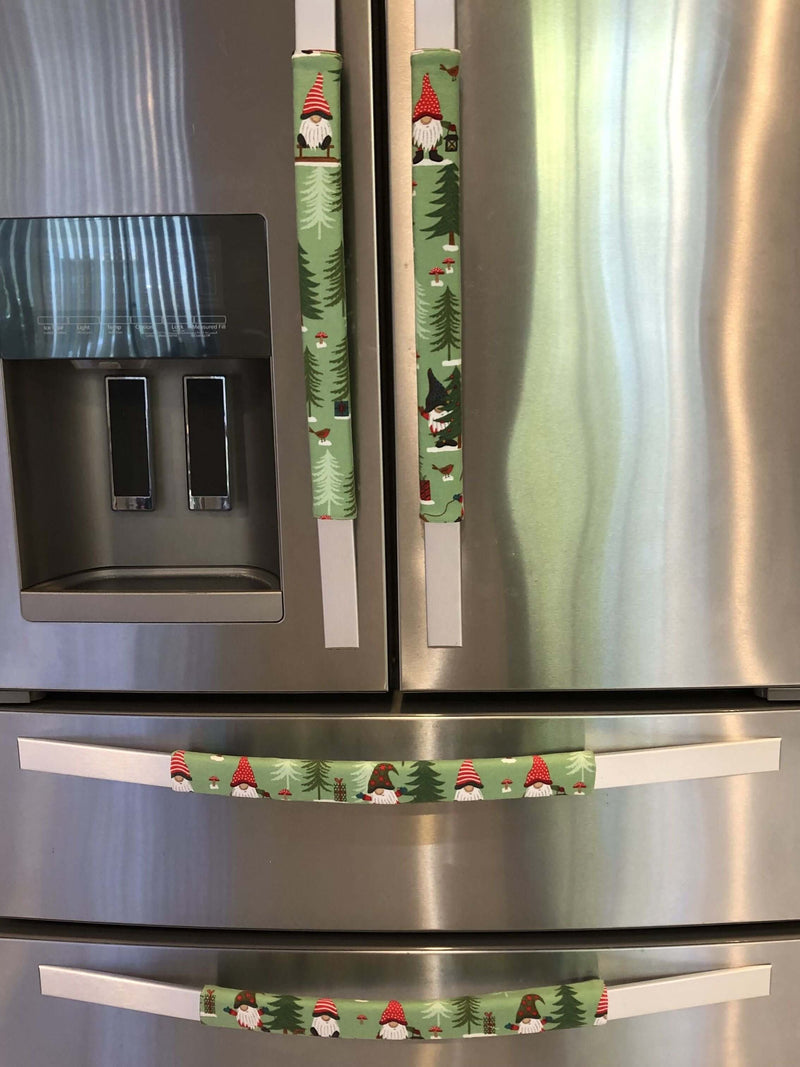 Gnomes on The Green Christmas Appliance Handle Covers on refrigerator handles in festive colors.