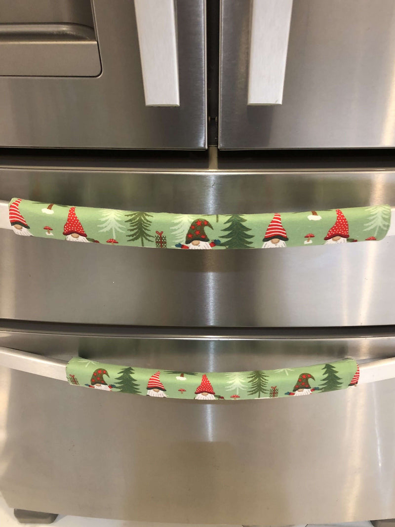 Gnomes on The Green Christmas Appliance Handle Covers on refrigerator handle in festive green, red, and white design.