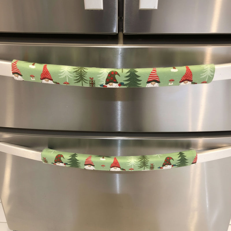 Gnomes on The Green Christmas Appliance Handle Covers on refrigerator handle in festive green, red, and white design.