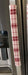 Gnomes on The Green Christmas Appliance Handle Covers in red and white plaid design on a refrigerator handle.