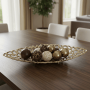 Elegant gold cutout aluminum decorative tray showcasing decorative balls on a wooden table, adding sophistication to decor.