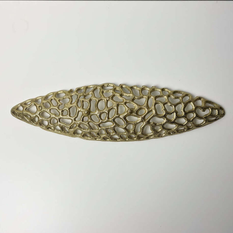 Gold cutout aluminum decorative tray with intricate design and lustrous finish, perfect for elegant table styling.