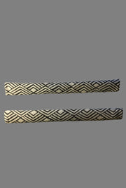 Geometric refrigerator handle covers in grey and white featuring a modern design for stylish kitchen decor.