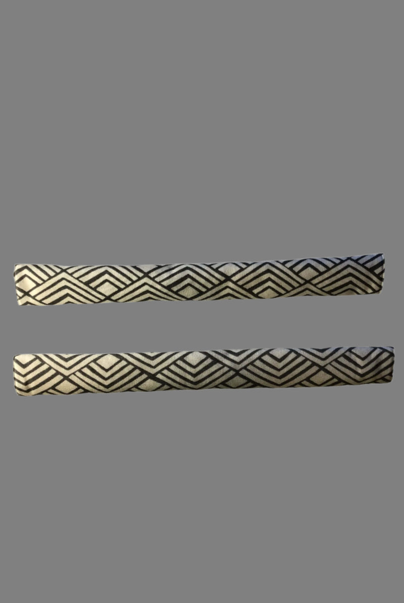 Geometric refrigerator handle covers in grey and white featuring a modern design for stylish kitchen decor.
