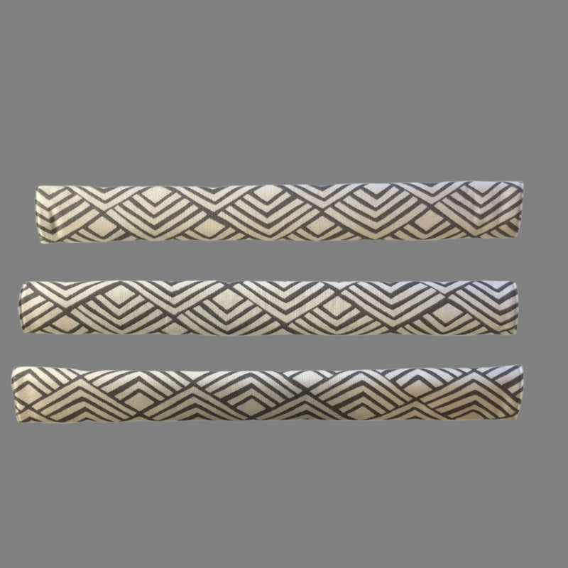 Geometric refrigerator handle covers in grey and white, showcasing a stylish, reversible design for your kitchen.