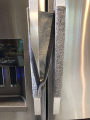 Grey Leaf Motif Appliance Handle Covers on stainless steel refrigerator handles for a stylish and practical touch.