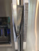 Grey Leaf Motif Appliance Handle Covers on stainless steel refrigerator handles for a stylish and practical touch.