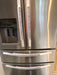 Grey and white gerbera daisy handle covers on stainless steel refrigerator doors for added protection and style.