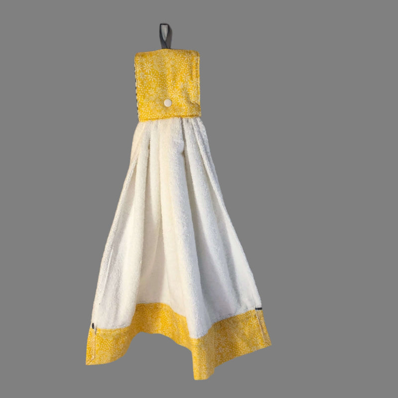 Handmade geometric kitchen hand towel showcasing yellow and white design with convenient hanging loop.