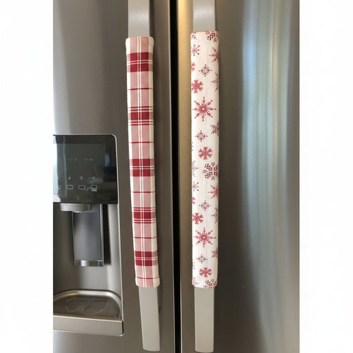 Pink snowflake appliance handle covers add winter charm to kitchen decor on refrigerator handles.
