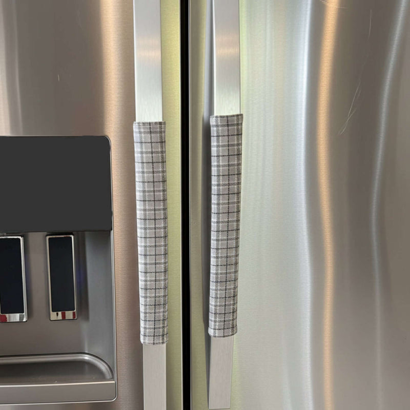 Stainless steel refrigerator with grey plaid handle covers