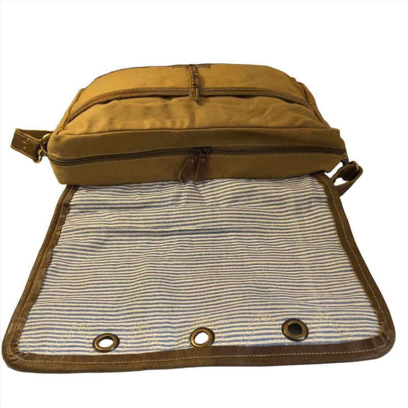 Music festival messenger bag with spacious interior and stylish design, featuring eco-friendly materials.