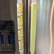 Pastel Mint Green & Lemon Print-Reversible Refrigerator Handle Covers on a refrigerator