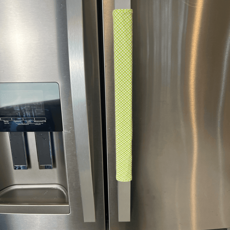 Pastel Mint Green & Lemon Print-Reversible Refrigerator Handle Covers on a kitchen refrigerator.