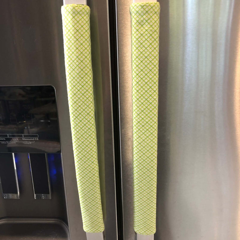 Pastel Mint Green & Lemon Print-Reversible Refrigerator Handle Covers on stainless steel refrigerator.